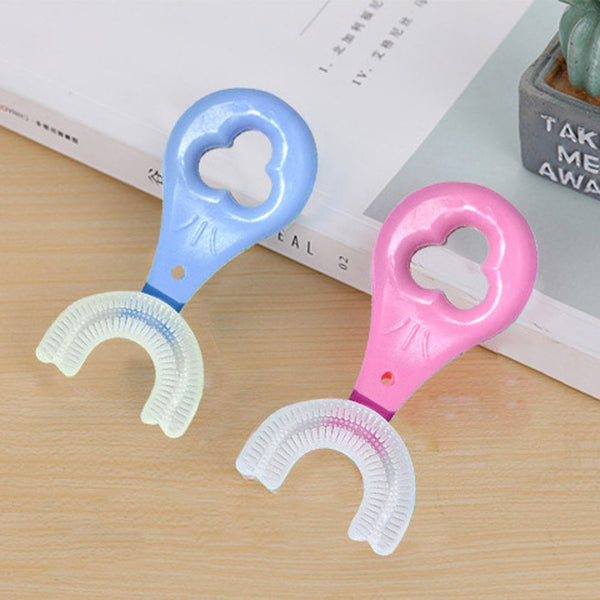 U-shaped toothbrush showing its compact design for childrenβs dental care.